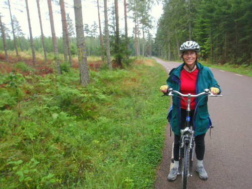 Terry stands next to a groomed forest.